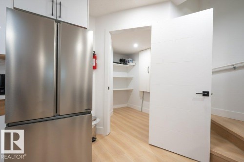 Stainless steel French door refrigerator with bottom freezer - 5627 Kootook Place, Edmonton, AB - Indoor