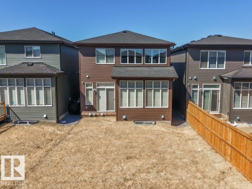 Contemporary two-story exterior with brown siding and white trim - 5627 Kootook Place, Edmonton, AB - Outdoor