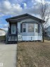 Light-colored siding exterior with dark trim accents - 1637 68 Avenue, Edmonton, AB  - Outdoor 