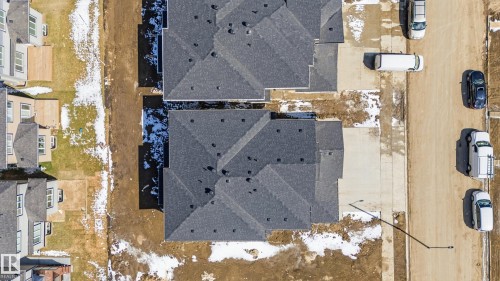 Newly constructed residential property featuring a dark shingle roof, concrete driveway, and front-facing garage - 3714 40 Avenue, Beaumont, AB - Outdoor With View