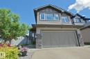 Modern two-story home featuring horizontal siding and stone accents - 9711 223 Street, Edmonton, AB 