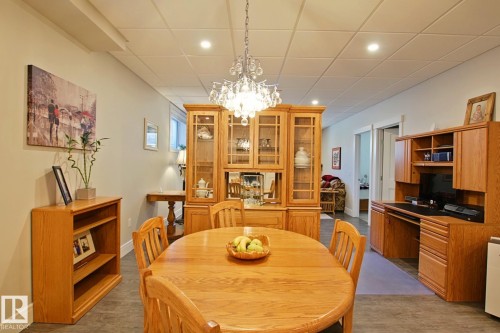 Open-concept room featuring recessed lighting, a decorative chandelier, and light-toned walls - 9711 223 Street, Edmonton, AB 