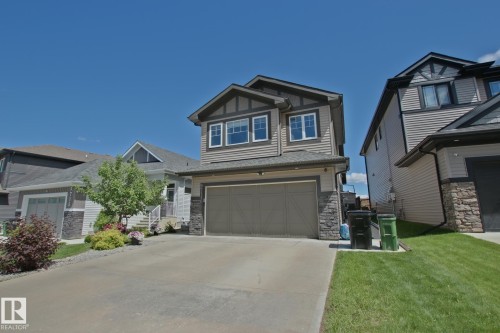 Two-story residence featuring composite siding and stone accents - 9711 223 Street, Edmonton, AB 