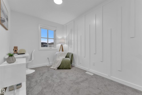 Interior room featuring grey carpeting, white walls, and a window with white trim - 269 Falcon Crescent, Leduc, AB - Indoor