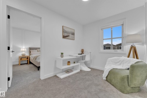 Carpeted room featuring a white interior, a window with exterior views, and a doorway opening to an additional room - 269 Falcon Crescent, Leduc, AB - Indoor Photo Showing Other Room