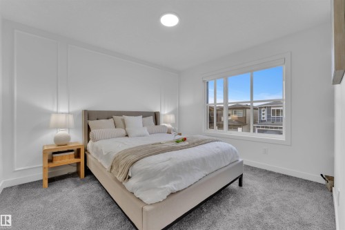 Bright bedroom with recessed ceiling lighting and a large window - 269 Falcon Crescent, Leduc, AB - Indoor Photo Showing Bedroom
