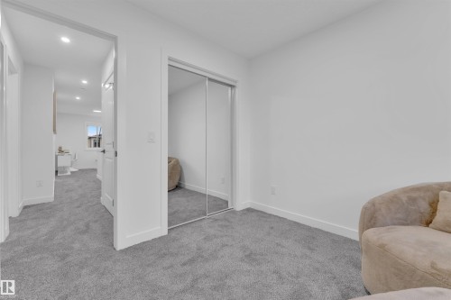 Neutral wall paint with recessed lighting, gray carpet flooring, and white trim - 269 Falcon Crescent, Leduc, AB - Indoor Photo Showing Other Room