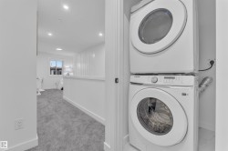 Dedicated laundry closet featuring a stacked washer and dryer - 