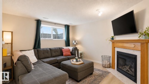 9745 71 Avenue, Edmonton, AB - Indoor Photo Showing Living Room With Fireplace