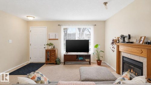 9745 71 Avenue, Edmonton, AB - Indoor Photo Showing Living Room With Fireplace