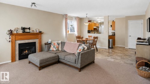 9745 71 Avenue, Edmonton, AB - Indoor Photo Showing Living Room With Fireplace