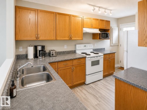 9745 71 Avenue, Edmonton, AB - Indoor Photo Showing Kitchen With Double Sink
