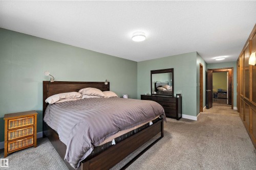 Spacious room with plush carpeting, light green walls, and white ceiling - 227 Westridge Road, Edmonton, AB - Indoor Photo Showing Bedroom