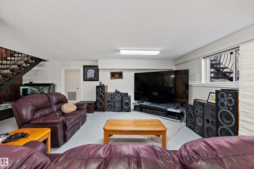 Recreation room featuring light-colored carpeting and white walls - 227 Westridge Road, Edmonton, AB - Indoor Photo Showing Living Room