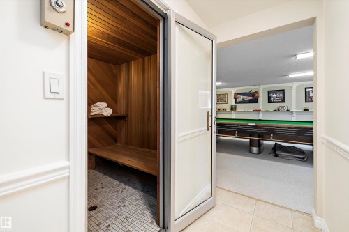 Wood-paneled sauna featuring a built-in bench and tiled floor - 227 Westridge Road, Edmonton, AB - Indoor Photo Showing Other Room