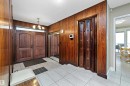 Entryway featuring wood-paneled walls and ceramic tile flooring - 227 Westridge Road, Edmonton, AB  -  Photo Showing Other Room 