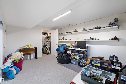 Spacious room featuring light-colored carpeting and white walls - 227 Westridge Road, Edmonton, AB - Indoor Photo Showing Other Room