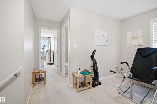 Interior closet featuring wire shelving, neutral wall tones, and white trim - 7323 24 Ave, Edmonton, AB - Indoor With Storage
