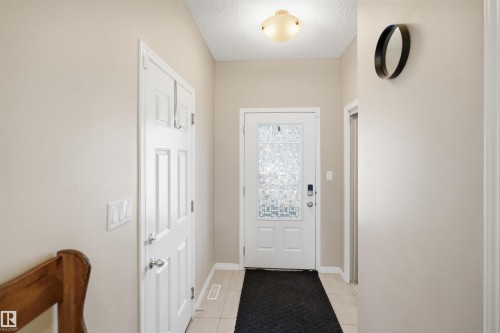 Dedicated laundry area featuring front-loading appliances - 7323 24 Ave, Edmonton, AB - Indoor Photo Showing Laundry Room