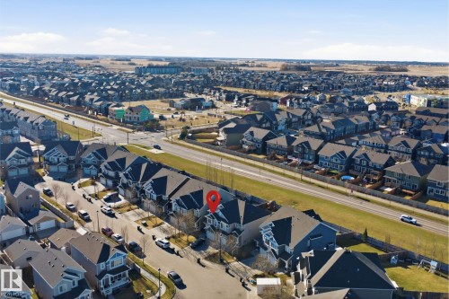 Aerial perspective highlighting a residential property within a structured neighborhood - 7323 24 Ave, Edmonton, AB -  With View