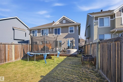 Contemporary townhome featuring a multi-tone facade with siding and stone accents - 7323 24 Ave, Edmonton, AB - Outdoor With Facade