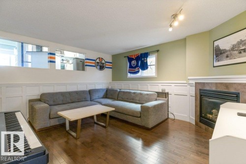 21414 94A Avenue, Edmonton, AB - Indoor Photo Showing Living Room With Fireplace