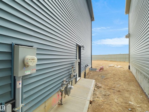 separate entrance to the basement with concrete walk path - 22803 80 Avenue, Edmonton, AB 