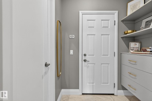 White paneled door with brushed nickel hardware - 1737 Dumont Crescent, Edmonton, AB - Indoor Photo Showing Other Room