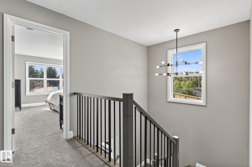 Upper-level landing with gray wall paint and textured white ceiling - 1737 Dumont Crescent, Edmonton, AB - Indoor Photo Showing Other Room