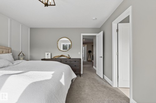 Bedroom featuring neutral carpeting and light gray wall paint - 1737 Dumont Crescent, Edmonton, AB - Indoor Photo Showing Bedroom
