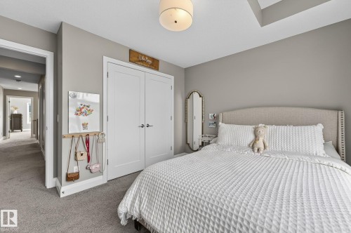 Neutral wall tones complement the plush gray carpeting - 1737 Dumont Crescent, Edmonton, AB - Indoor Photo Showing Bedroom