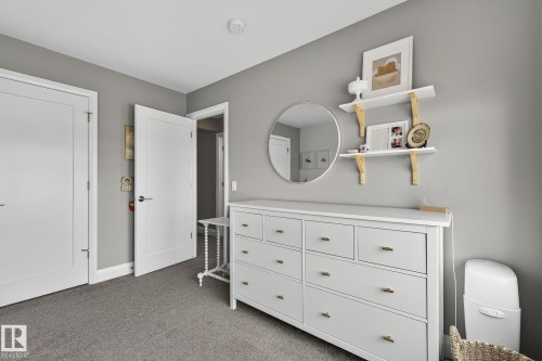 Bedroom with light gray walls, gray carpeting, and white trim - 1737 Dumont Crescent, Edmonton, AB - Indoor