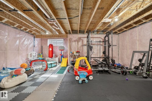 Unfinished basement featuring exposed wood joists and insulation-wrapped walls - 1737 Dumont Crescent, Edmonton, AB - Indoor Photo Showing Basement