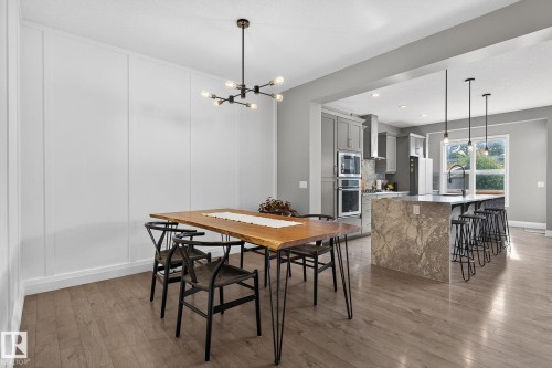Dining area featuring wainscoting and wood-finish flooring - 1737 Dumont Crescent, Edmonton, AB - Indoor
