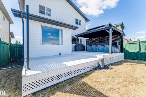 Expansive outdoor decking featuring a privacy gazebo and lattice skirting - 847 Blacklock Way, Edmonton, AB - Outdoor With Deck Patio Veranda With Exterior