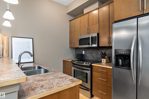 415 10531 117 Street, Edmonton, AB - Indoor Photo Showing Kitchen With Stainless Steel Kitchen With Double Sink