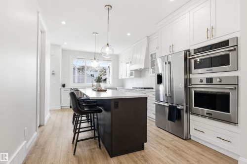 Show stopper kitchen! Island will easily accommodate 5 people. This is a chef's dream layout. - 10430 143 Street, Edmonton, AB - Indoor Photo Showing Kitchen With Upgraded Kitchen