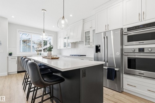 Double oven and microwave! Gas stove top. Tons of cupboard space. You also have a huge pantry. - 10430 143 Street, Edmonton, AB - Indoor Photo Showing Kitchen With Upgraded Kitchen