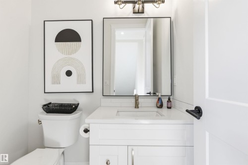 Main floor powder room is private and right off your side entrance. Guests can use this and not ruin the party. - 10430 143 Street, Edmonton, AB - Indoor Photo Showing Bathroom