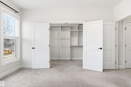 Plenty of space for a fashion diva and quartz counters on your dresser drawers - 10430 143 Street, Edmonton, AB - Indoor Photo Showing Other Room