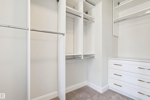 Primary bedroom with walk in closet - 10430 143 Street, Edmonton, AB - Indoor With Storage