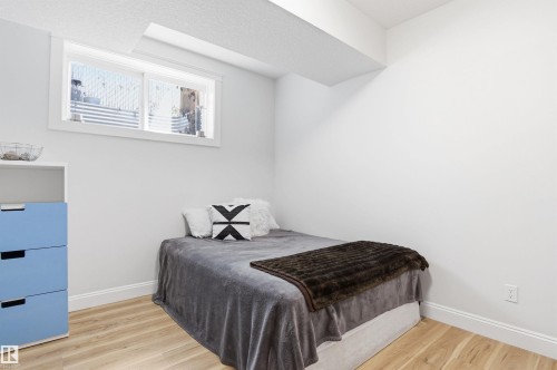 This is the 4th of 5 bedrooms. Large closet and big window make this an ideal bedroom. - 10430 143 Street, Edmonton, AB - Indoor Photo Showing Bedroom