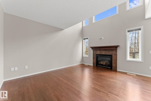 516 Fairway Terrace, Stony Plain, AB - Indoor Photo Showing Living Room With Fireplace