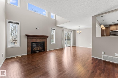 516 Fairway Terrace, Stony Plain, AB - Indoor Photo Showing Living Room With Fireplace