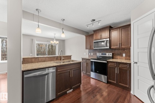 516 Fairway Terrace, Stony Plain, AB - Indoor Photo Showing Kitchen With Double Sink