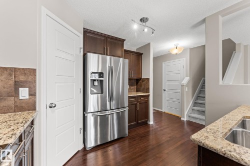 516 Fairway Terrace, Stony Plain, AB - Indoor Photo Showing Kitchen With Double Sink