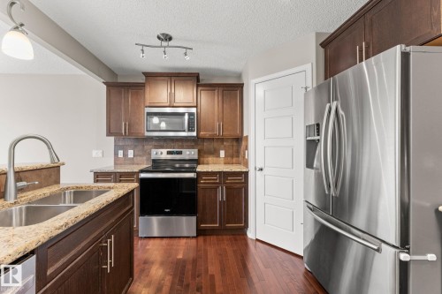 516 Fairway Terrace, Stony Plain, AB - Indoor Photo Showing Kitchen With Double Sink