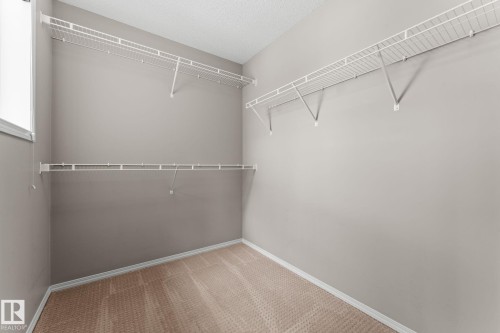 Primary Bedroom Walk-in Closet - 516 Fairway Terrace, Stony Plain, AB - Indoor With Storage