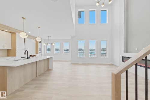 The open concept interior features light wood flooring throughout - 17 Trill Point(E), Spruce Grove, AB - Indoor