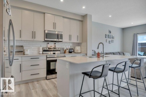 161 Larch Crescent, Leduc, AB - Indoor Photo Showing Kitchen With Upgraded Kitchen